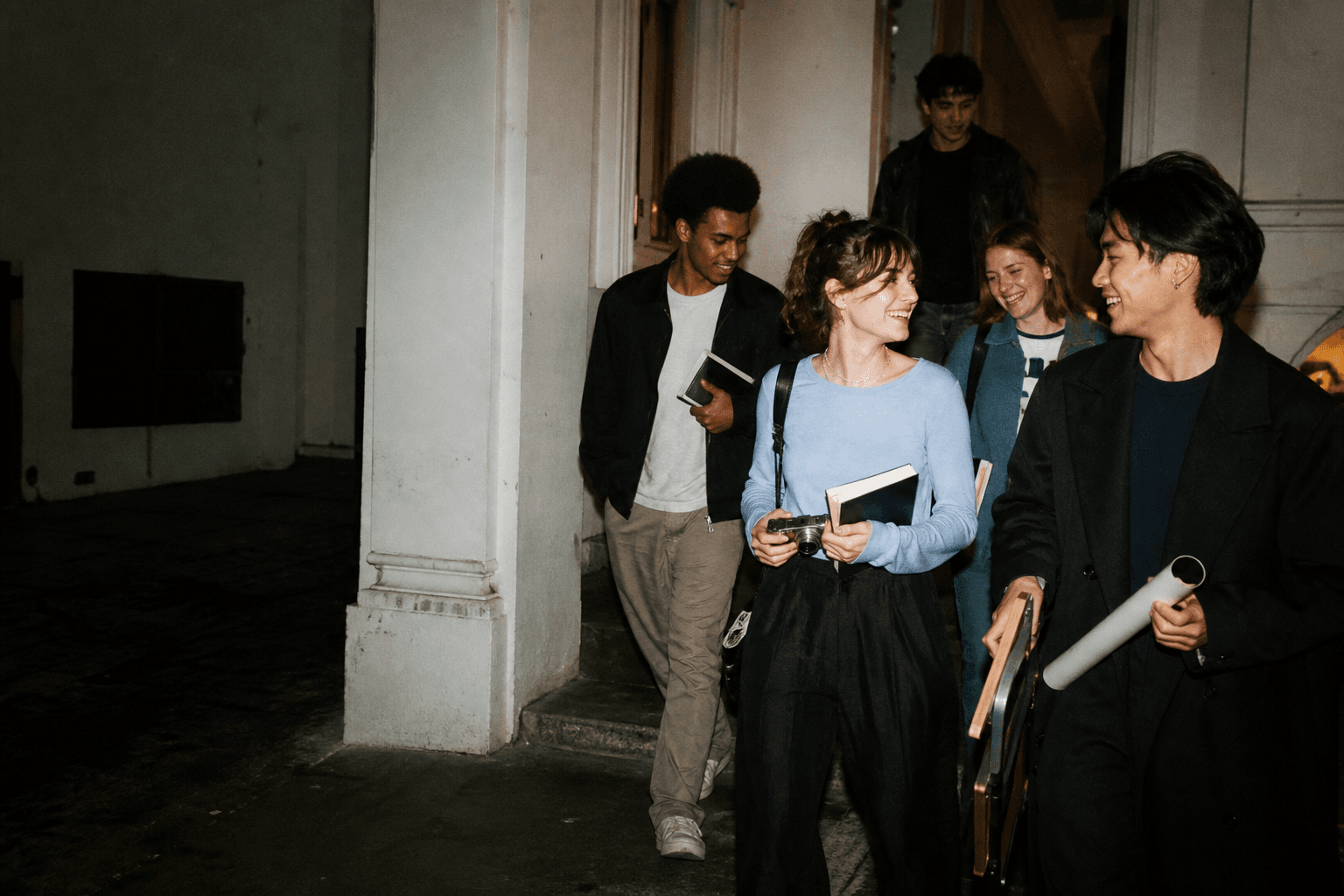 Students leaving an evening gathering together